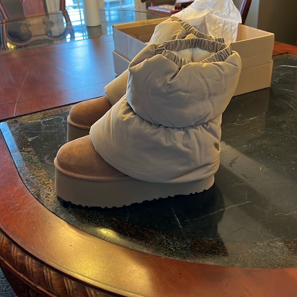 Never worn, brand new, micropuffer platform Ugg.  Size 6.